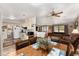 Kitchen and dining area with wood floors at 37610 Quail Ridge Cir, Leesburg, FL 34788