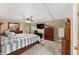 Main bedroom with wood furniture and carpet at 37610 Quail Ridge Cir, Leesburg, FL 34788