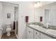 Double vanity bathroom with granite countertop at 3818 Zentko St, The Villages, FL 32163