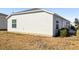 Exterior of a house showing vinyl siding and a small yard at 3818 Zentko St, The Villages, FL 32163