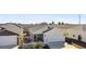 Exterior view of a house with a garage and white picket fence at 3818 Zentko St, The Villages, FL 32163