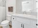 A bathroom with a large sink and a white toilet is designed with a white theme at 3822 Miragalia Ln, The Villages, FL 32163