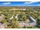 Aerial image showcasing a community of buildings nestled within a verdant landscape at 40 Moree Loop # 1, Winter Springs, FL 32708