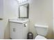 Clean bathroom with white vanity, toilet and updated fixtures at 40 Moree Loop # 1, Winter Springs, FL 32708