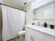 Bathroom with white vanity, quartz countertop, and a large mirror at 40 Moree Loop # 1, Winter Springs, FL 32708