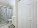 Clean bathroom with white vanity, shower, and tiled floor at 40 Moree Loop # 1, Winter Springs, FL 32708