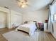 Well-lit bedroom with a queen bed and an en-suite bathroom at 40 Moree Loop # 1, Winter Springs, FL 32708