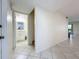 Clean entryway with view of updated bathroom and stairs at 40 Moree Loop # 1, Winter Springs, FL 32708