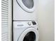 Convenient laundry closet with stacked Samsung washer and dryer at 40 Moree Loop # 1, Winter Springs, FL 32708