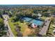 Aerial view of well-maintained tennis courts with surrounding greenery at 40 Moree Loop # 1, Winter Springs, FL 32708