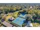 Aerial photograph showcasing several tennis courts and a nearby building at 40 Moree Loop # 1, Winter Springs, FL 32708