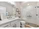 Beautiful bathroom featuring a stand-up shower with patterned glass, a toilet, and a sink with a quartz countertop at 4515 Biggs Pl, The Villages, FL 32163