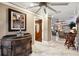 Entryway leading into a spacious living room with multiple ceiling fans, views of large windows, and beautiful tile floors at 4515 Biggs Pl, The Villages, FL 32163