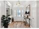 Welcoming foyer with natural light, beautiful tile floors, and a view of the elegant entryway at 4515 Biggs Pl, The Villages, FL 32163