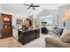 Comfortable home office with dark wood desk, large window and accent lighting at 4515 Biggs Pl, The Villages, FL 32163