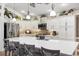 Beautiful kitchen with stainless steel appliances, white cabinets, and a large center island at 4515 Biggs Pl, The Villages, FL 32163