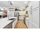 Well-equipped kitchen featuring stainless steel appliances, a central island, and wood flooring at 4515 Biggs Pl, The Villages, FL 32163