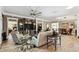 Spacious living room featuring a large built-in entertainment center, neutral colors and comfortable seating at 4515 Biggs Pl, The Villages, FL 32163