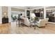 Comfortable living room featuring stylish decor, an entertainment center, and seamless access to the patio at 4515 Biggs Pl, The Villages, FL 32163