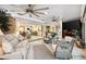 Spacious living room featuring neutral walls, lots of windows, tile floors, and comfortable seating at 4515 Biggs Pl, The Villages, FL 32163