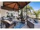 Inviting screened porch with comfortable seating, ceiling fan, and peaceful outdoor views at 4515 Biggs Pl, The Villages, FL 32163