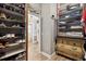 Walk-in closet with custom shelving and storage solutions at 4515 Biggs Pl, The Villages, FL 32163