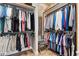 Spacious walk-in closet with custom shelving and organization for clothes and accessories at 4515 Biggs Pl, The Villages, FL 32163
