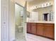 Elegant bathroom with double vanity and shower at 4985 Rainbow Trout Rd, Tavares, FL 32778