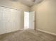 Neutral bedroom with plush carpeting and a spacious closet at 4985 Rainbow Trout Rd, Tavares, FL 32778