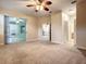 Main bedroom with access to bathroom and patio at 4985 Rainbow Trout Rd, Tavares, FL 32778