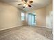 Bedroom with sliding door to patio access at 4985 Rainbow Trout Rd, Tavares, FL 32778