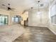 Dining room with wood-look tile floor and a view to kitchen and living room at 4985 Rainbow Trout Rd, Tavares, FL 32778