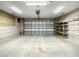 Spacious garage with built-in shelving and epoxy floor at 4985 Rainbow Trout Rd, Tavares, FL 32778