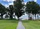 Enjoy serene lake views from a peaceful lakeside path at 4985 Rainbow Trout Rd, Tavares, FL 32778