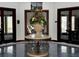 Elegant lobby with marble floors and large doors at 4985 Rainbow Trout Rd, Tavares, FL 32778