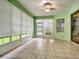 Sunroom with tile floors and window blinds at 4985 Rainbow Trout Rd, Tavares, FL 32778