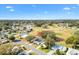 Aerial view of the community, highlighting the golf course and surrounding landscape at 525 Bonita Dr, Lady Lake, FL 32159