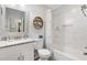 Bright bathroom features a modern vanity and tiled shower at 525 Bonita Dr, Lady Lake, FL 32159