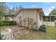 Home's exterior with patio, AC unit, and outdoor shower at 5301 Se 115Th Pl, Belleview, FL 34420