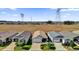 Aerial view of a community with several homes at 6206 Dingman Way, The Villages, FL 32163