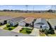 Aerial view of a community of homes with landscaped yards at 6206 Dingman Way, The Villages, FL 32163