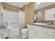 Clean bathroom with tub shower combo, vanity, and neutral-toned finishes at 6206 Dingman Way, The Villages, FL 32163