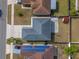 Aerial view of a home showcasing its roofline, yard and driveway at 6739 Lorain Street, Orlando, FL 32810