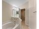 Bathroom boasts a bathtub, shower, and updated vanity at 6739 Lorain Street, Orlando, FL 32810