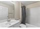 Clean bathroom with a shower/tub combo and modern vanity at 6739 Lorain Street, Orlando, FL 32810