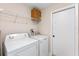 Convenient laundry room with washer, dryer, and shelving at 6739 Lorain Street, Orlando, FL 32810