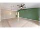 Bright living room with tile floors and a green accent wall at 6739 Lorain Street, Orlando, FL 32810