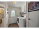 Small laundry room with washer, dryer, and access to bathroom at 705 Devon Dr, Lady Lake, FL 32159