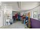 Workshop with sink, shelving, and various tools at 705 Devon Dr, The Villages, FL 32159