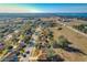 Aerial view of residential neighborhood with lake access at 733 Cherry Laurel St, Minneola, FL 34715